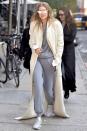 <p>In grey sweats and sneakers, an extra-long textured white coat and reflective cat-eyed Max Mara sunglasses while out in New York. </p>