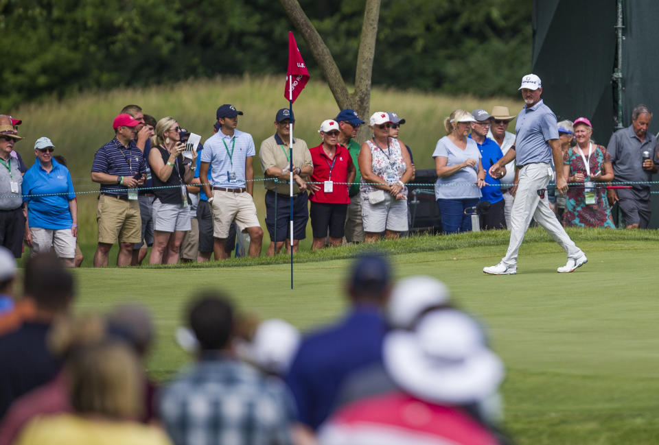 Jerry Kelly walks on the seventh green with a gallery looking on during the final round of the U.S. Senior Open golf tournament Sunday, June 30, 2019, in South Bend, Ind. (Robert Franklin/South Bend Tribune via AP)