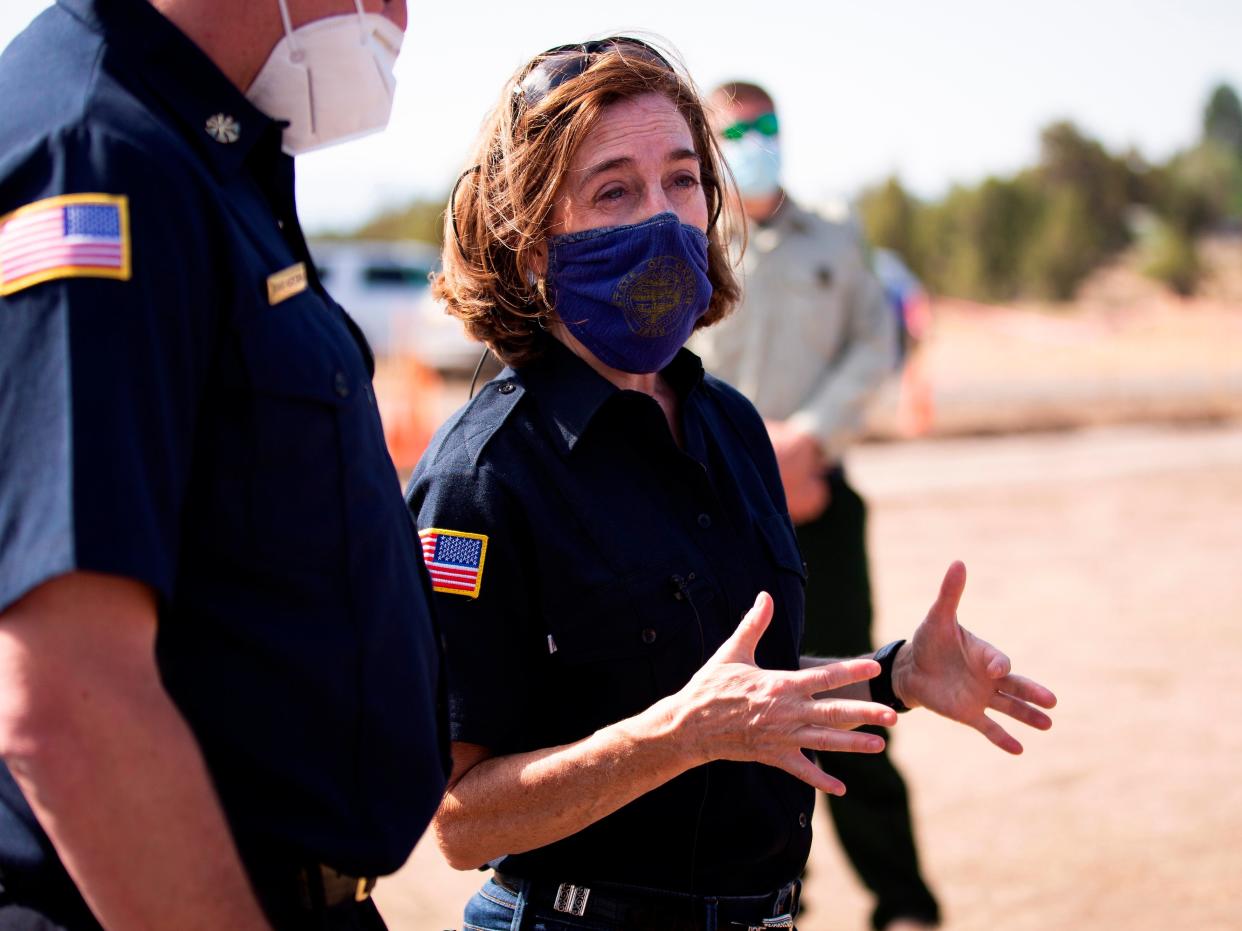 Oregon Governor Kate Brown at the southern edge of the Bootleg Fire, in Klamath County on 28 June, 2021 (AP)
