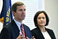 Kentucky Governor-Elect Andy Beshear, left, and his Lt. Governor Jacqueline Coleman speak with reporters following the concession of incumbent Governor Matt Bevin in Frankfort, Ky., Thursday, Nov. 14, 2019. In a recanvass, Beshear defeated Bevin by 5136 votes. (AP Photo/Timothy D. Easley)