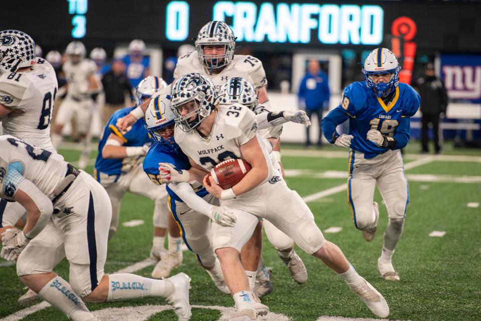 West Morris vs Cranford in the North, Group 3 regional championship game at MetLife Stadium on Friday, November 26, 2021. WM #32 Stefano Montella tries to avoid a tackle in the first quarter. 