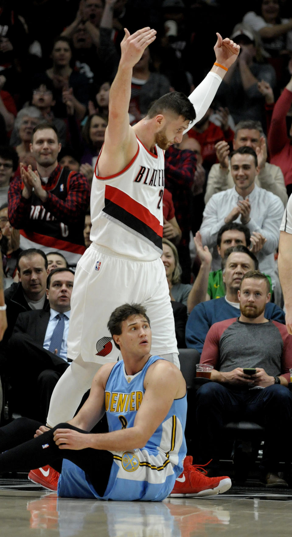 Portland Trail Blazers center Jusuf Nurkic eggs on the crowd after scoring and drawing a foul on Denver Nuggets forward Danilo Gallinari during the first half of an NBA basketball game in Portland, Ore., Tuesday, March 28, 2017. (AP Photo/Steve Dykes)