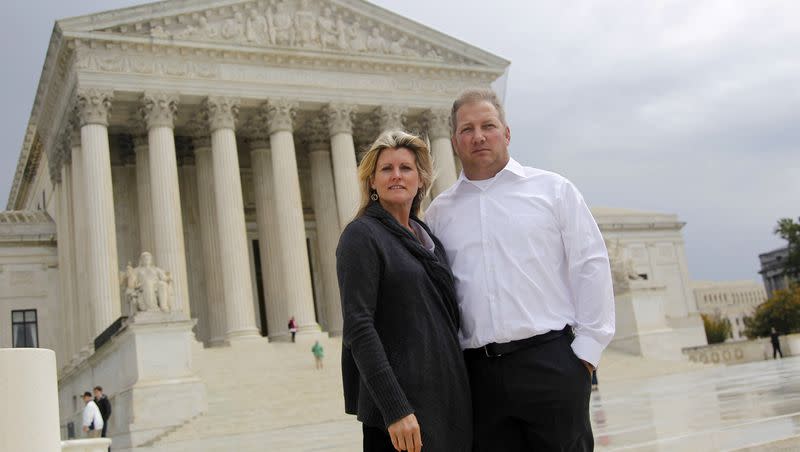 Michael and Chantell Sackett of Priest Lake, Idaho, pose for a photo in front of the Supreme Court in Washington on Oct. 14, 2011. The Supreme Court on Thursday, May 25, 2023, made it harder for the federal government to police water pollution in a decision that strips protections from wetlands that are isolated from larger bodies of water. The justices boosted property rights over concerns about clean water in a ruling in favor of the Sacketts, who sought to build a house near Priest Lake.
