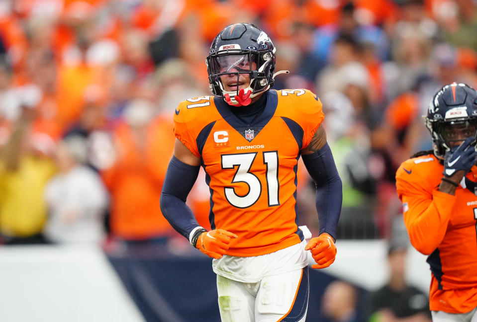 Sep 10, 2023; Denver, Colorado, USA; Denver Broncos safety <a class="link " href="https://sports.yahoo.com/nfl/players/29332" data-i13n="sec:content-canvas;subsec:anchor_text;elm:context_link" data-ylk="slk:Justin Simmons;sec:content-canvas;subsec:anchor_text;elm:context_link;itc:0">Justin Simmons</a> (31) reacts to a turnover in the third quarter against the <a class="link " href="https://sports.yahoo.com/nfl/teams/las-vegas/" data-i13n="sec:content-canvas;subsec:anchor_text;elm:context_link" data-ylk="slk:Las Vegas Raiders;sec:content-canvas;subsec:anchor_text;elm:context_link;itc:0">Las Vegas Raiders</a> at Empower Field at Mile High. Mandatory Credit: Ron Chenoy-USA TODAY Sports