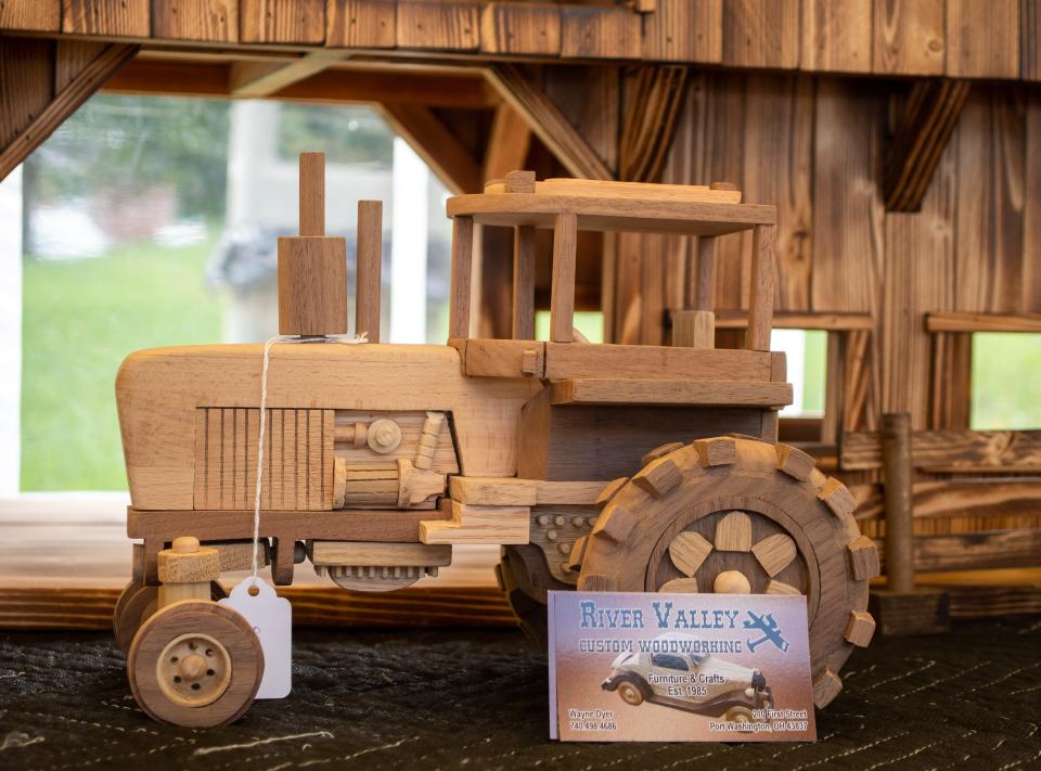 Wayne Dyer, of Port Washington, created this wooden tractor for his woodworking business, River Valley Custom Woodworking. Dyer will be returning to the Salt Fork Arts and Crafts Festival for the 2023 event.