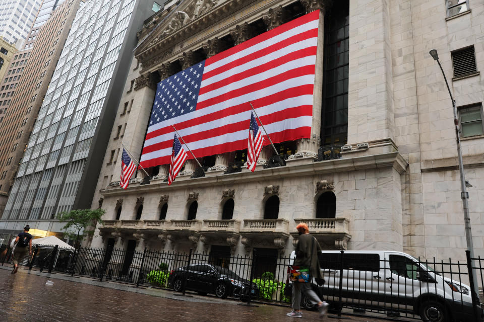 NEW YORK, NEW YORK - SEPTEMBER 06: People walk past the  the New York Stock Exchange before the start of morning trading on September 06, 2022 in New York City. President of Ukraine Volodymyr Zelensky delivered a message before the ringing of the opening bell to highlight the launch of Advantage Ukraine, an initiative aimed at driving foreign direct investment in Ukraine, as stocks fell to open the week of trading.  (Photo by Michael M. Santiago/Getty Images)