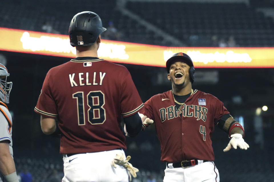 Arizona Diamondbacks' Ketel Marte celebrates with Carson Kelly (18) after hitting a two-run home run against the New York Mets in the first inning during a baseball game, Wednesday, June 2, 2021, in Phoenix. (AP Photo/Rick Scuteri)