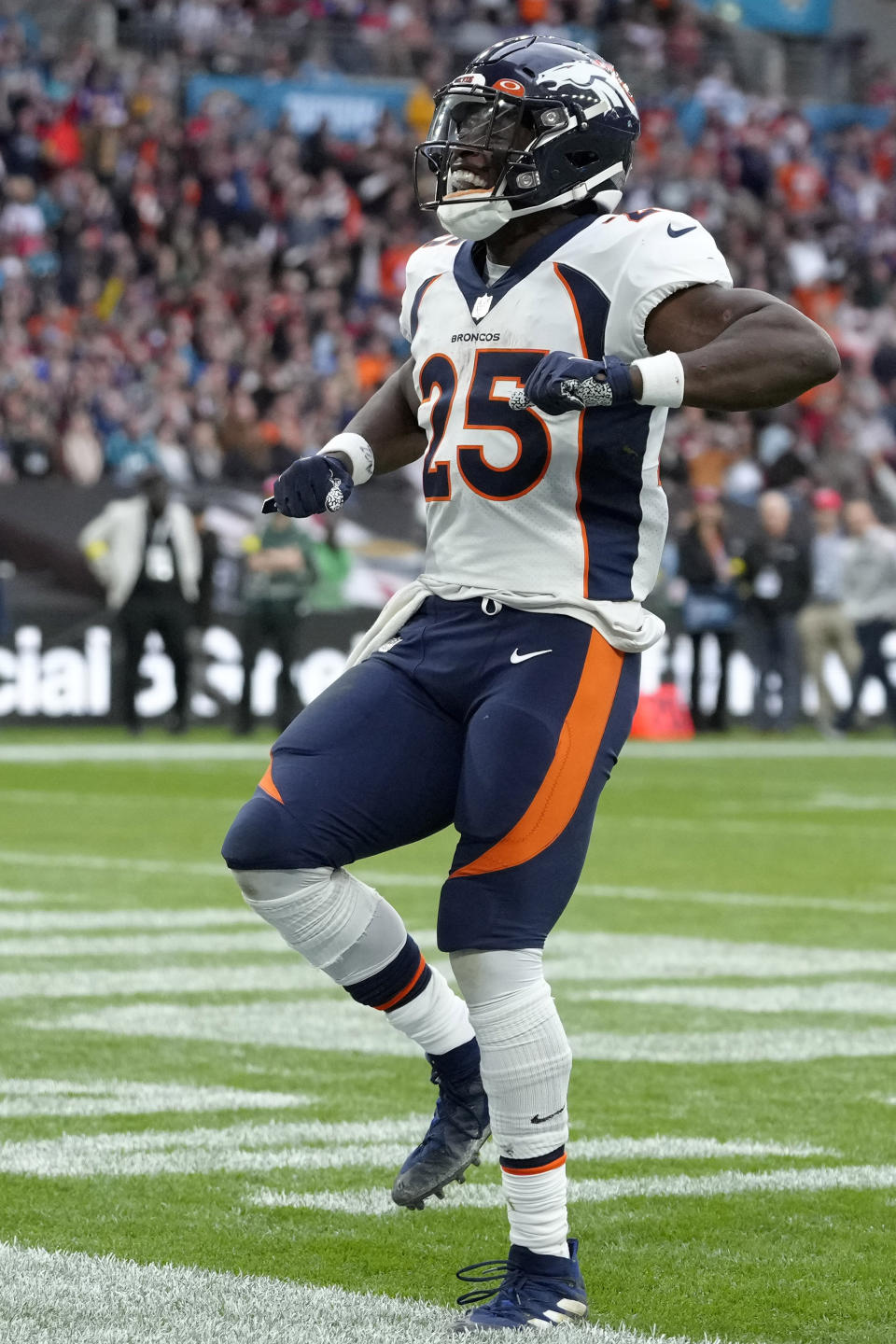 Denver Broncos running back Melvin Gordon III (25) celebrates a touchdown during the NFL football game between Denver Broncos and Jacksonville Jaguars at Wembley Stadium London, Sunday, Oct. 30, 2022. (AP Photo/Kirsty Wigglesworth)