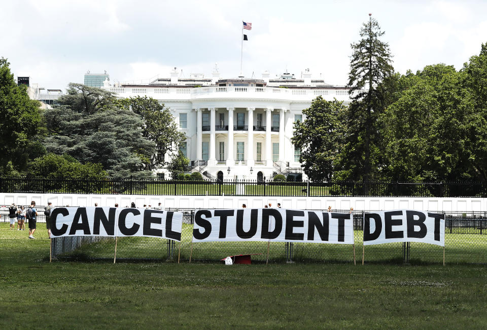 WASHINGTON, DC - JUNE 15: As college students around the country graduate with a massive amount of debt, advocates display a hand-painted sign on the Ellipse in front of The White House to call on President Joe Biden to sign an executive order to cancel student debt  on June 15, 2021 in Washington, DC.  (Photo by Paul Morigi/Getty Images for We The 45 Million)