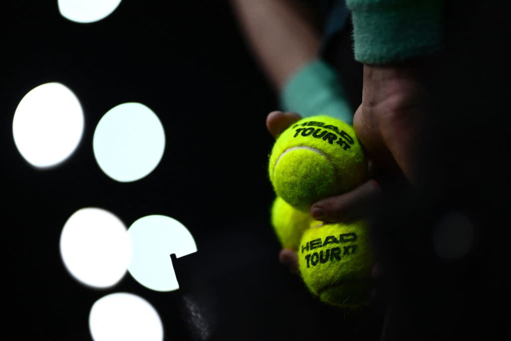 A ball kid keeps tennis ball during the men's singles quarter-final match between Greece's Stefanos Tsitsipas and Karen Khachanov on day five of the Paris ATP Masters 1000 tennis tournament at the Accor Arena - Palais Omnisports de Paris-Bercy - in Paris on November 3, 2023. (Photo by JULIEN DE ROSA / AFP) (Photo by JULIEN DE ROSA/AFP via Getty Images)