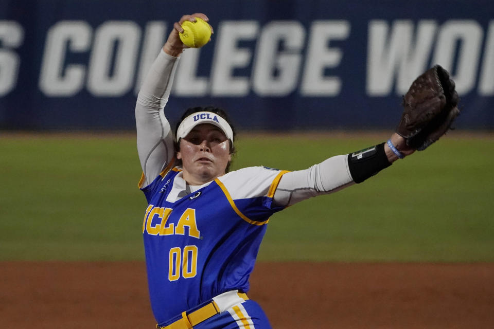 UCLA's Rachel Garcia pitches in the first inning of an NCAA Women's College World Series softball game against Alabama, Friday, June 4, 2021, in Oklahoma City. (AP Photo/Sue Ogrocki)