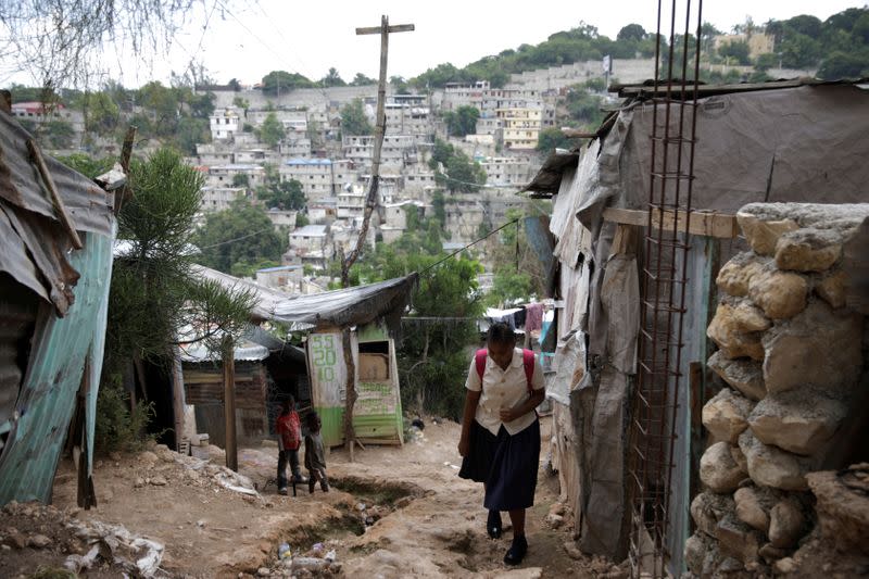 Nickerla Ambroise Etienne walks in her neighbourhood on her way to school in Port-au-Prince