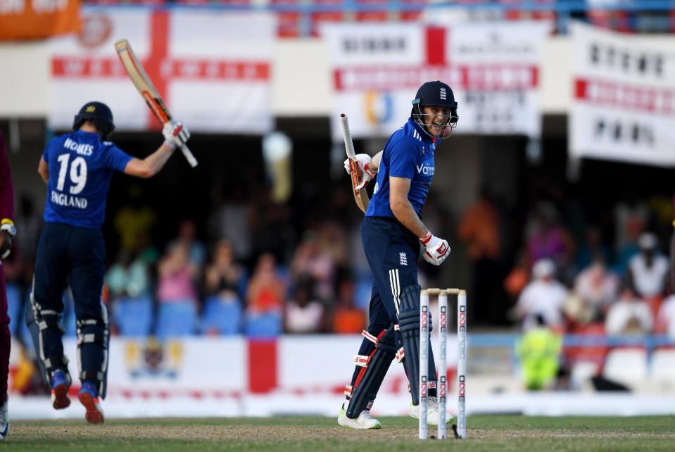 Joe Root celebrates after securing victory with England: Getty