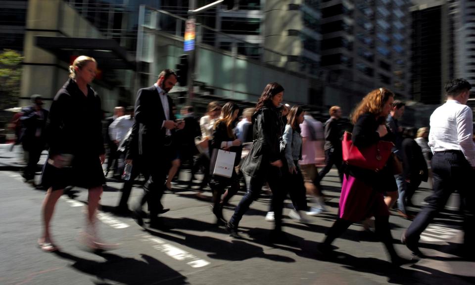 <span>Office workers and shoppers walk through Sydney's central business district. Australia’s unemployment rate recorded a surprise drop in February, according to the Australia Bureau of Statistics.</span><span>Photograph: Jason Reed/Reuters</span>