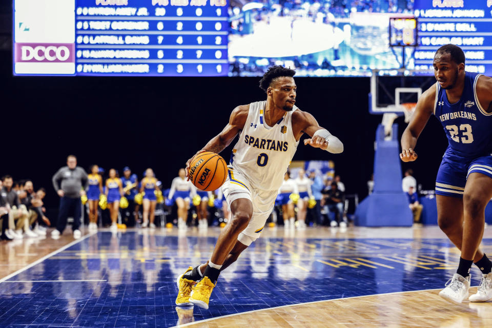 In this image provided by San Jose State University Athletics, San Jose State's Myron "MJ" Amey Jr. (0) goes for a basket against New Orleans, Dec. 9, 2023, in San Jose, Calif. Antelope Valley College volleyball player Cameron Nelsen, along with Amey who is transferring to Loyola Marymount from San Jose State, are winners of the final CalHOPE Courage Award for this school year. (SJSU Athletics via AP)