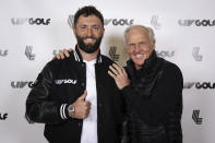 In a photo provided by LIV Golf, Jon Rahm, left, and LIV Golf Commissioner and CEO Greg Norman pose for a photo in New York on Thursday, Dec. 7, 2023. Rahm announced Thursday he's joining LIV Golf. (Photo by Scott Taetsch/LIV Golf via AP)