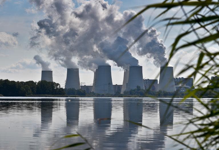 Smoke rises from the cooling towers of Vattenfall's lignite-fired power plant in Jaenschwalde, eastern Germany on August 25, 2014