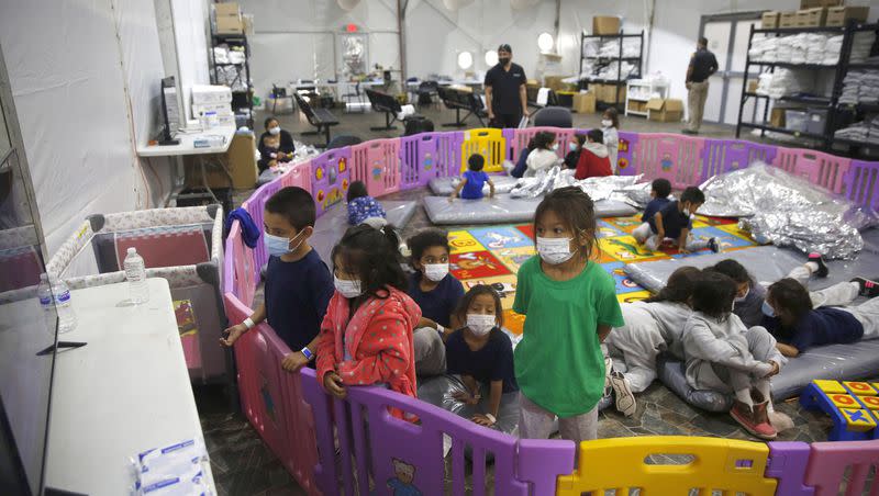 Young unaccompanied migrants watch television at the U.S. Customs and Border Protection facility on March 30, 2021, in Donna, Texas.