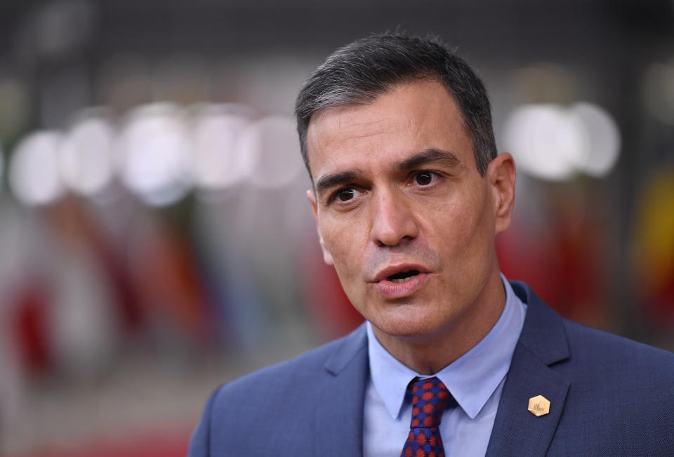 Spain's Prime Minister Pedro Sanchez speaks as he arrives for an EU summit at the European Council building in Brussels, Thursday, Dec. 10, 2020. European Union leaders meet for a year-end summit that will address anything from climate, sanctions against Turkey to budget and virus recovery plans. Brexit will be discussed on the sidelines. (John Thys, Pool via AP)