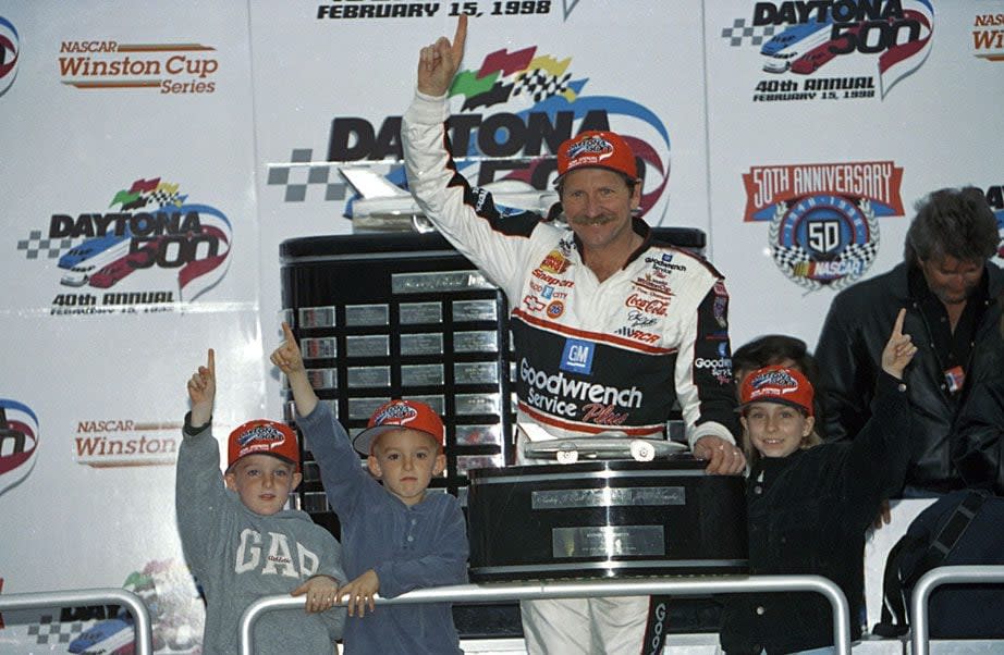 Dale Earnhardt raises his finger in Victory Lane after the 1998 Daytona 500