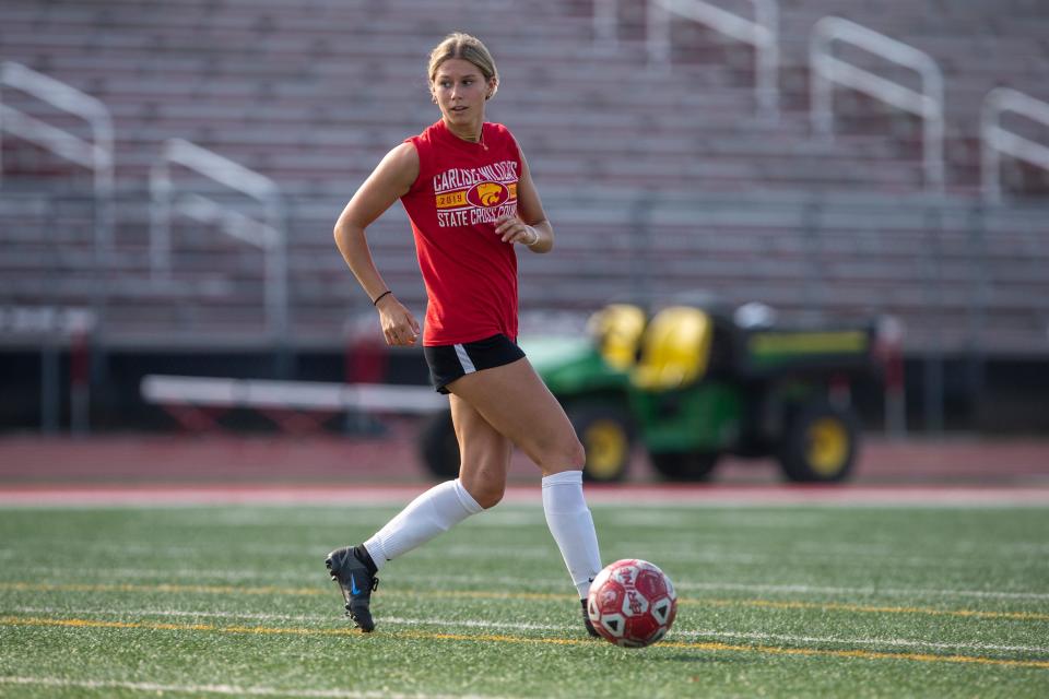 Carlisle senior Ainsley Erzen balances soccer and track seasons during the spring. She's become a star in both sports and will play them both at Arkansas.