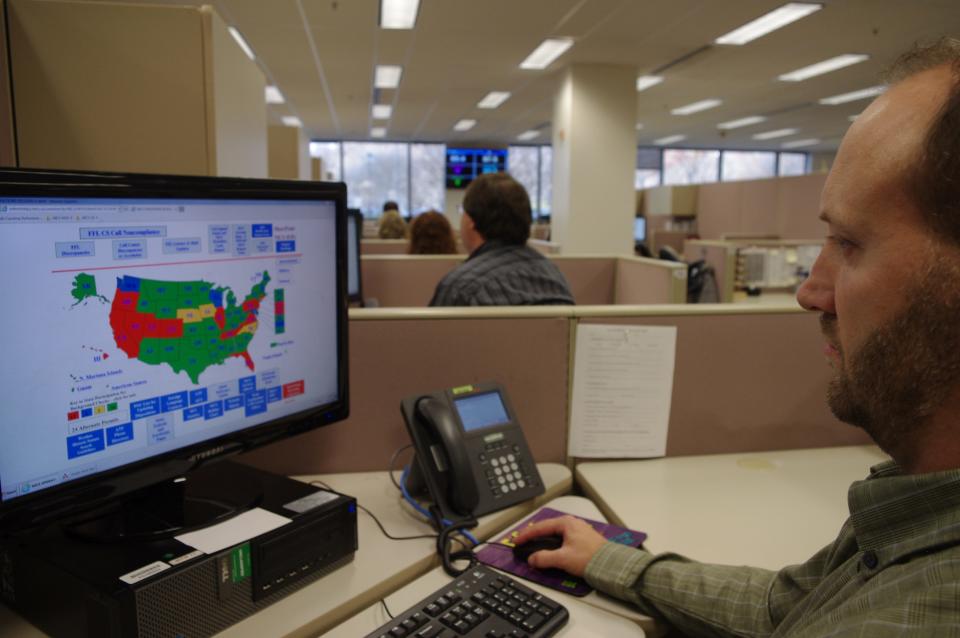 A researcher simulates a check done for the National Instant Criminal Background Check System or NICS, at the FBI's criminal justice center in Bridgeport, West Virginia, in 2014.