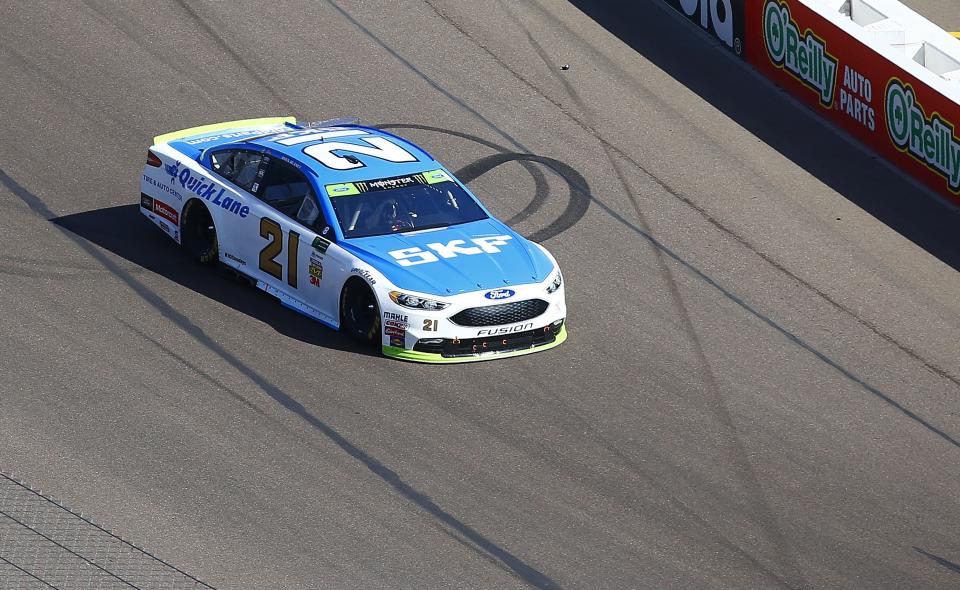 Ryan Blaney (21) heads into the first turn during a NASCAR Cup Series auto race at Phoenix International Raceway Sunday, Nov. 12, 2017, in Avondale, Ariz. (AP Photo/Ross D. Franklin)