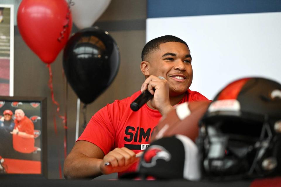 Central Catholic’s Anthony Todd speaks to the crowd gathered during a National Signing Day ceremony at Central Catholic High School  in Modesto, Calif., Wednesday, Dec. 20, 2023. Todd signed to play football at Simpson University in Redding, California.