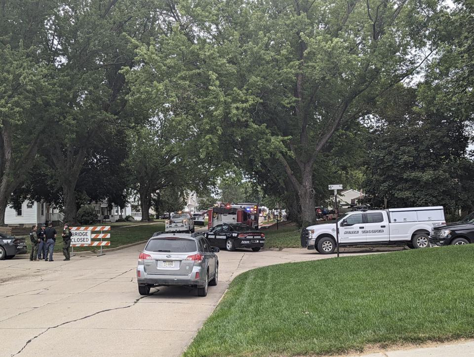 Barricades block off a portion of Elm Street in Laurel, Neb., Thursday, Aug. 4, 2022. The Nebraska State Patrol is investigating a situation with multiple fatalities that occurred in Laurel on Thursday morning. Emergency personnel from the state patrol, Belden and the Cedar County Sheriff's Department were working in the area. (Riley Tolan-Keig/The Norfolk Daily News via AP)