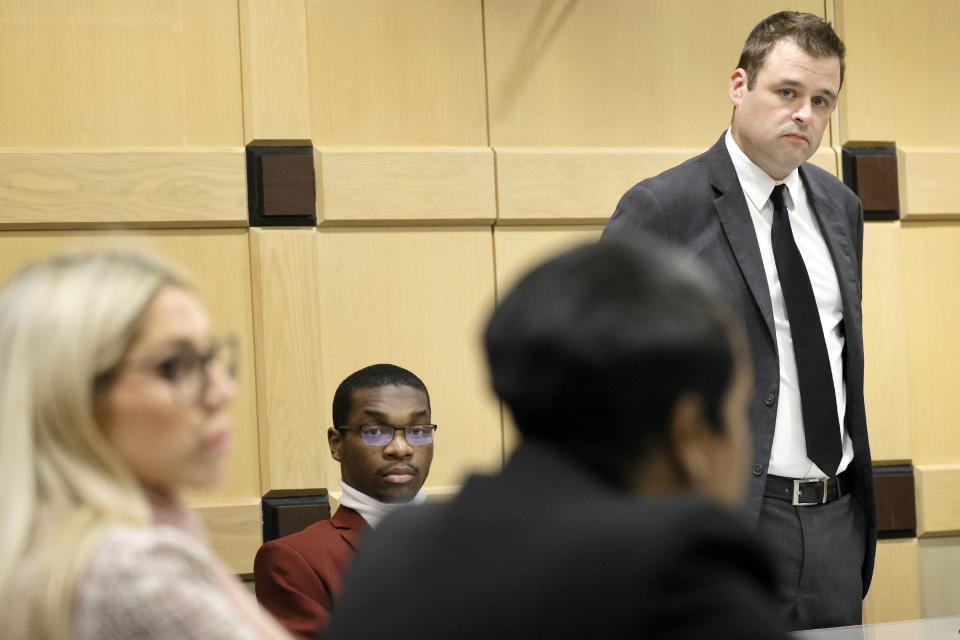 Attorney Joseph Kimok addresses Assistant State Attorneys Pascale Achille, right, and Alixandra Buckelew as his client, shooting suspect Michael Boatwright, is seated next to him during the fourth day of jury deliberations in the XXXTentacion murder trial at the Broward County Courthouse in Fort Lauderdale, Fla., on Monday, March 13, 2023. Emerging rapper XXXTentacion, born Jahseh Onfroy, 20, was killed during a robbery outside of Riva Motorsports in Pompano Beach in 2018, allegedly by defendants Boatwright, Trayvon Newsome, and Dedrick Williams. (Amy Beth Bennett/South Florida Sun-Sentinel via AP, Pool)