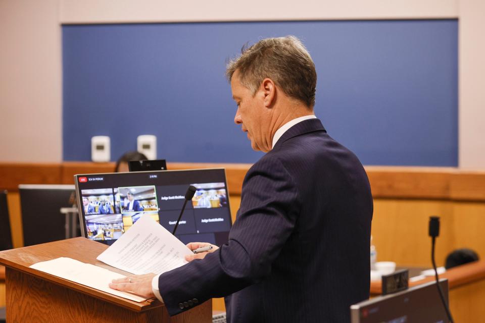 Brian Rafferty, attorney for Sidney Powell, addresses the court during a motions hearing in front of Fulton County Superior Court Judge Scott McAfee in Atlanta, Thursday, Oct. 5, 2023. Nineteen people, including former President Donald Trump, were indicted in August and accused of participating in a wide-ranging illegal scheme to overturn the results of the 2020 presidential election. (Erik S. Lesser/Pool Photo, via AP)