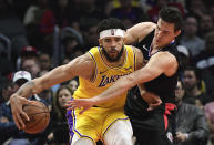 Los Angeles Clippers forward Danilo Gallinari, right, reaches in on Los Angeles Lakers center JaVale McGee during the first half of an NBA basketball game Friday, April 5, 2019, in Los Angeles. (AP Photo/Mark J. Terrill)