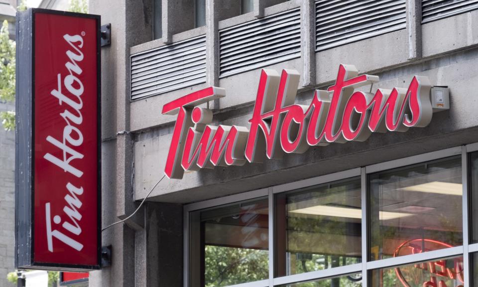 A Tim Horton logo is pictured in Montreal on June 21, 2016. Customer disinterest in lunch at Tim Hortons -- including the heavily promoted and hastily dropped Beyond Meat burger -- dragged down its sales last quarter, though revenues at its parent company shot up thanks to the other two fast-food chains under the umbrella of Restaurant Brands International Inc. RBI chief executive Jose Cil said earnings at the coffee-and-donut chain 