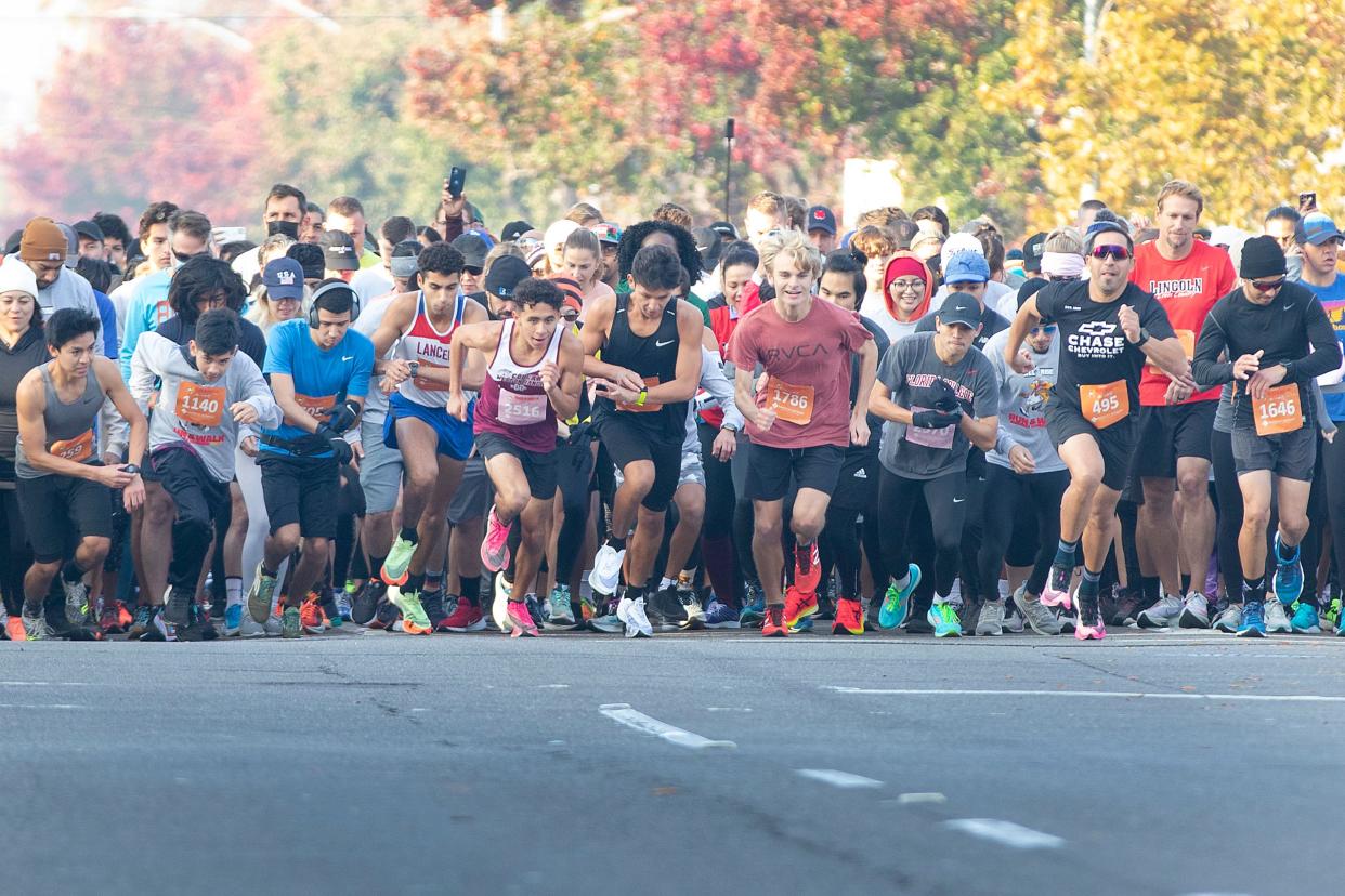 Runners set their watches at the start of the 17th Annual Run & Walk Against Hunger on Nov. 25th. 