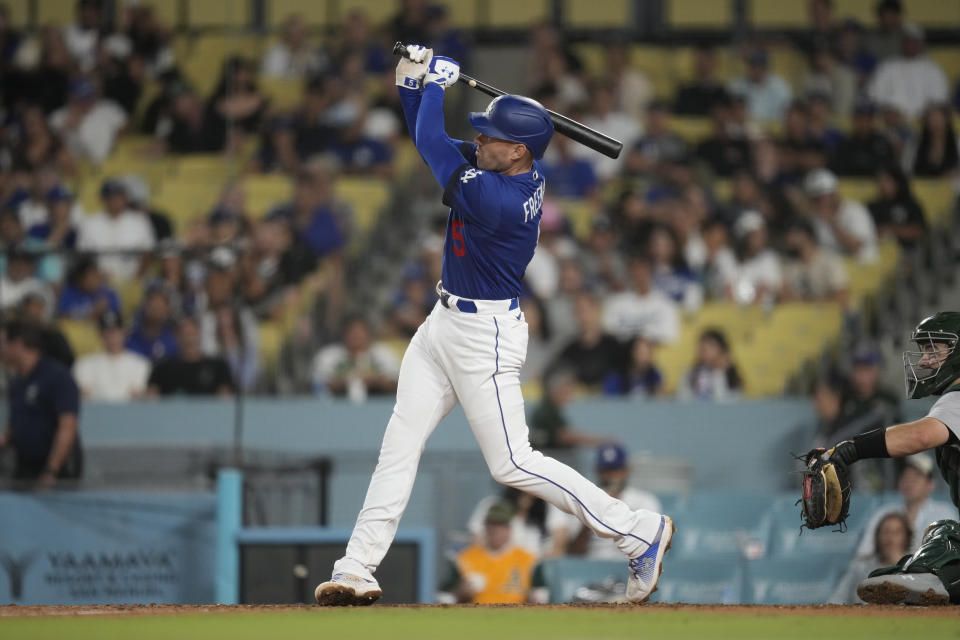 Los Angeles Dodgers' Freddie Freeman (5) hits a home run during the eighth inning of a baseball game against the Oakland Athletics in Los Angeles, Thursday, Aug. 3, 2023. (AP Photo/Ashley Landis)