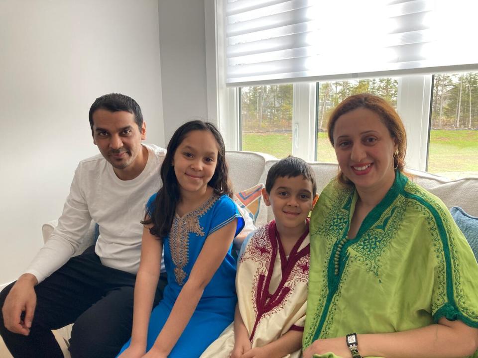 Ibtissam Farhani, her son Wissam, daughter Cyrine and husband Houssam in their new Moncton home. The family visits their local mosque in an effort to keep ties to their culture. 