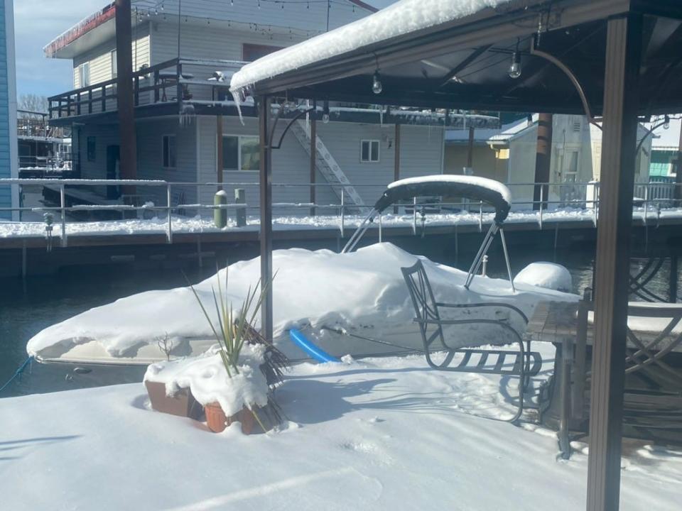 speed boat at a doc covered in snow
