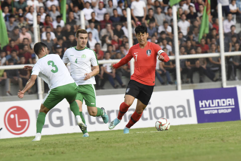 South Korea's Son Heung-min, right, controls the ball during the World Cup Group H qualifying soccer match between Turkmenistan and South Korea at the Kopetdag Stadium in Ashgabat, Turkmenistan, Tuesday, Sept. 10, 2019. (AP Photo/Alexander Vershinin)