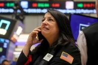 FILE PHOTO: Traders work on the floor of the NYSE in New York