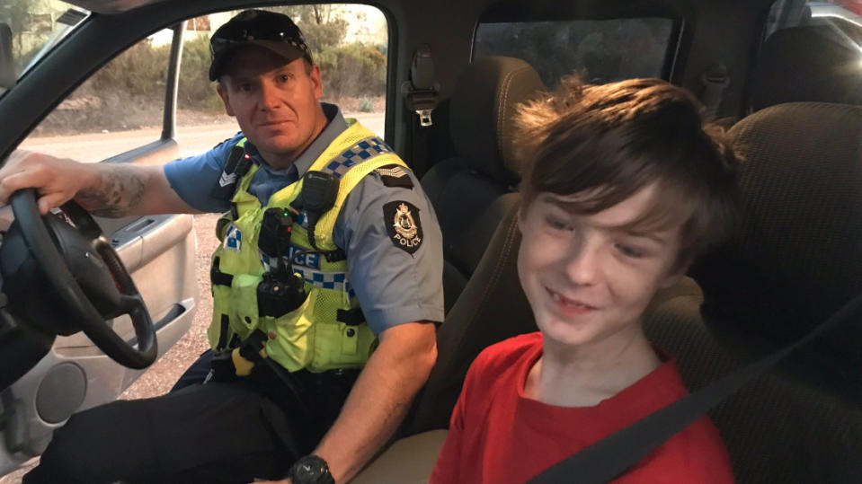 Luke Sturrock (right) with one of the Dalwallinu Police officers (left) who helped save him.