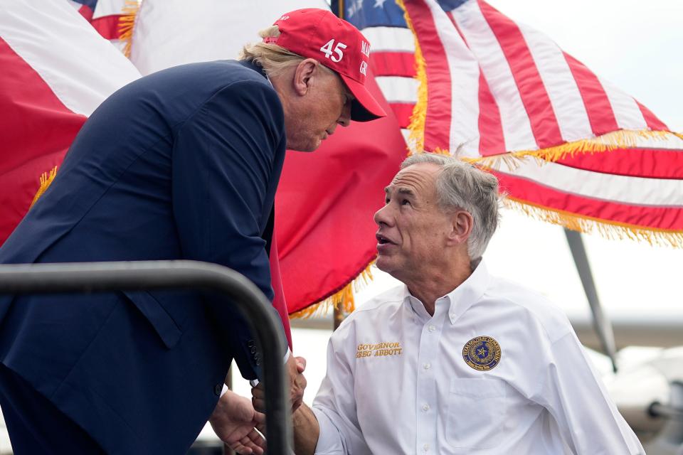 Former President Donald Trump shakes hands with Gov. Greg Abbott after he received Abbott's endorsement during a visit to Edinburg last fall.