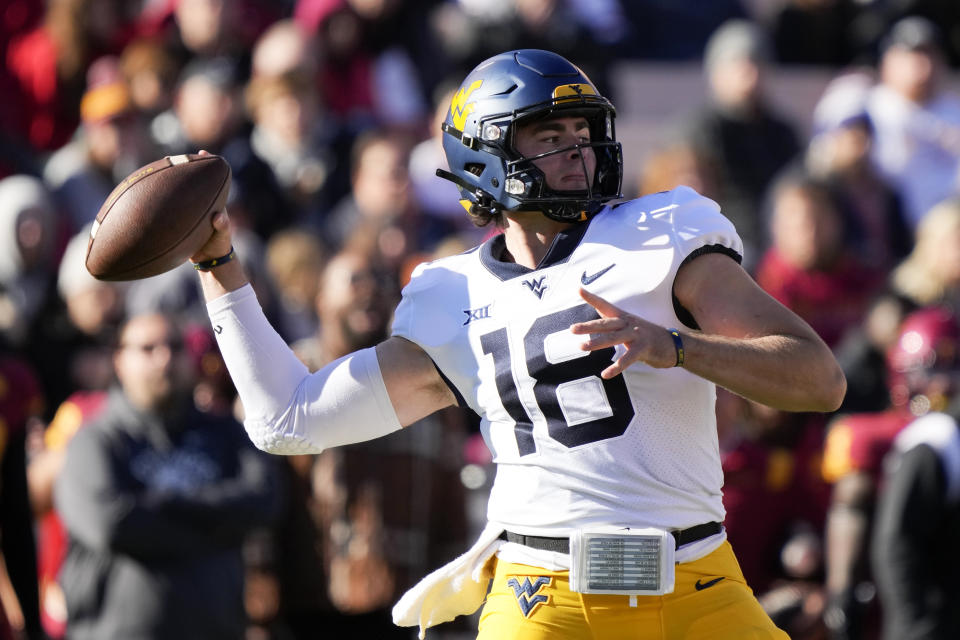 West Virginia quarterback JT Daniels (18) throws a pass during the first half of an NCAA college football game against Iowa State, Saturday, Nov. 5, 2022, in Ames, Iowa. (AP Photo/Charlie Neibergall)