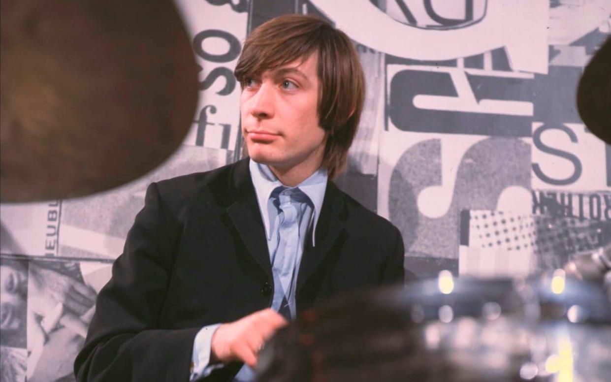 Charlie Watts (on Ready Steady Go!, circa 1964): a penchant for Savile Row suits - TV Times via Getty Images