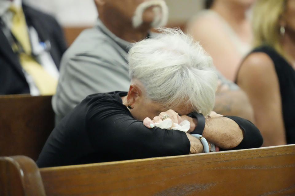 A courtroom attendee reacts at a hearing at the Rankin County Circuit Court, during which six former Mississippi law officers pleaded guilty to state charges for torturing two Black men in a racist assault, after admitting their guilt in a connected federal civil rights case, Monday, Aug. 14, 2023 in Brandon, Miss. (AP Photo/Rogelio V. Solis)
