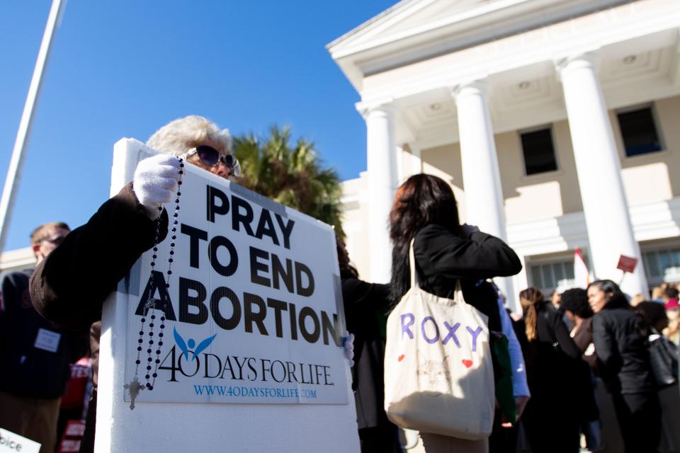 Abortion-rights and anti-abortion activists voice their opinions outside the Florida Supreme Court after the Court heard arguments on the proposed abortion amendment Wednesday, Feb. 7, 2024.