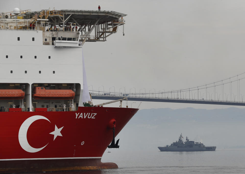 Turkey's 230-meter (750-foot) drillship 'Yavuz' escorted by a Turkish Navy vessel, crosses the Marmara Sea on its way to the Mediterranean, from the port of Dilovasi, outside Istanbul, Thursday, June 20, 2019. Turkey had launched Yavuz, that it says will drill for gas off neighboring Cyprus despite European Union warnings to refrain from such illegal actions that could incur sanctions against Ankara. (AP Photo/Lefteris Pitarakis)