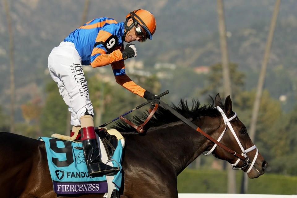 John Velazquez celebrates as he rides Fierceness after winning the Breeders' Cup Juvenile horse race Friday, Nov. 3, 2023 at Santa Anita Park in Arcadia, Calif. (AP Photo/Ashley Landis)