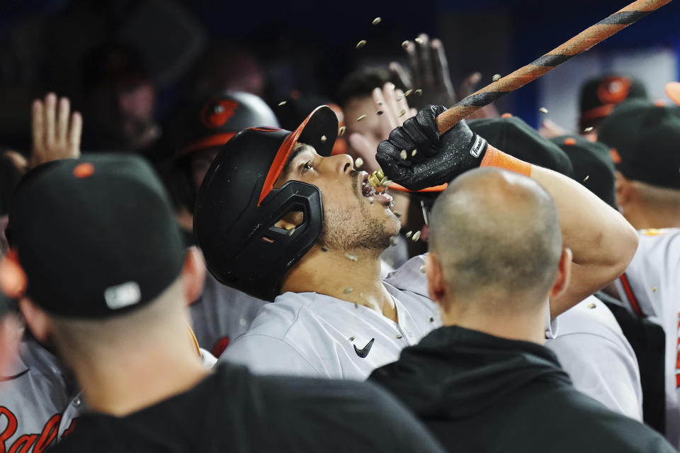 Baltimore Orioles' Anthony Santander (25) celebrates his grand slam against the Toronto Blue Jays during the eighth inning of a baseball game in Toronto on Tuesday, Aug. 1, 2023. (Nathan Denette/The Canadian Press via AP)