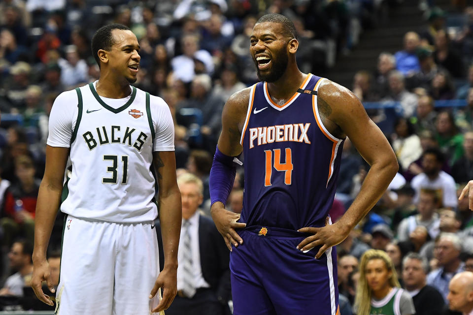 Greg Monroe (right) smiles like a man who just got set free to find a new home in time for the playoffs. (Getty)