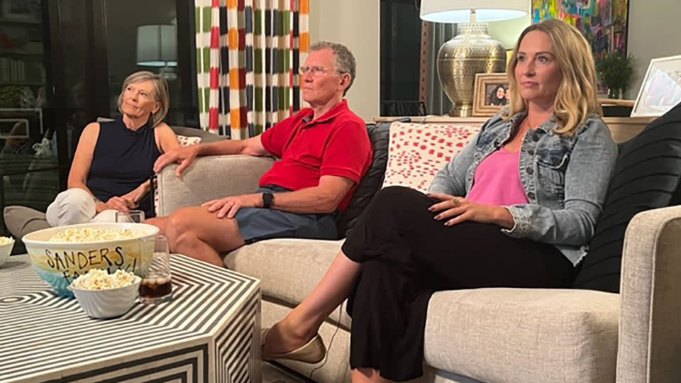 Betsy Sarcone, right, watches the GOP debate with her parents Russ and Susan Sanders. - Allie Malloy/CNN